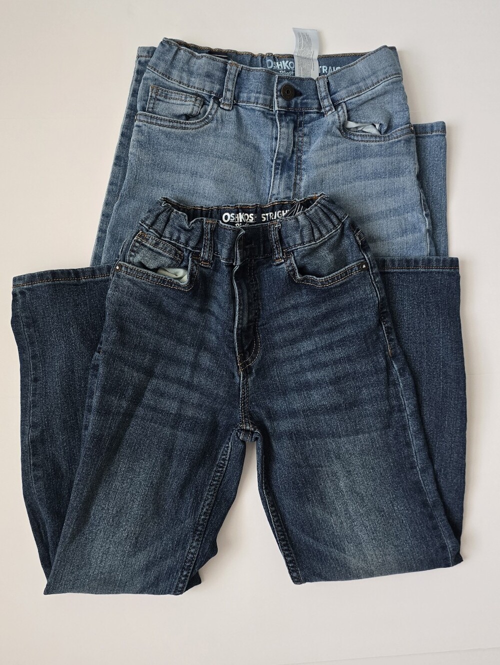 2 Pack. OshKosh B'gosh Kid's Straight Jeans in Light Blue and Dark Blue